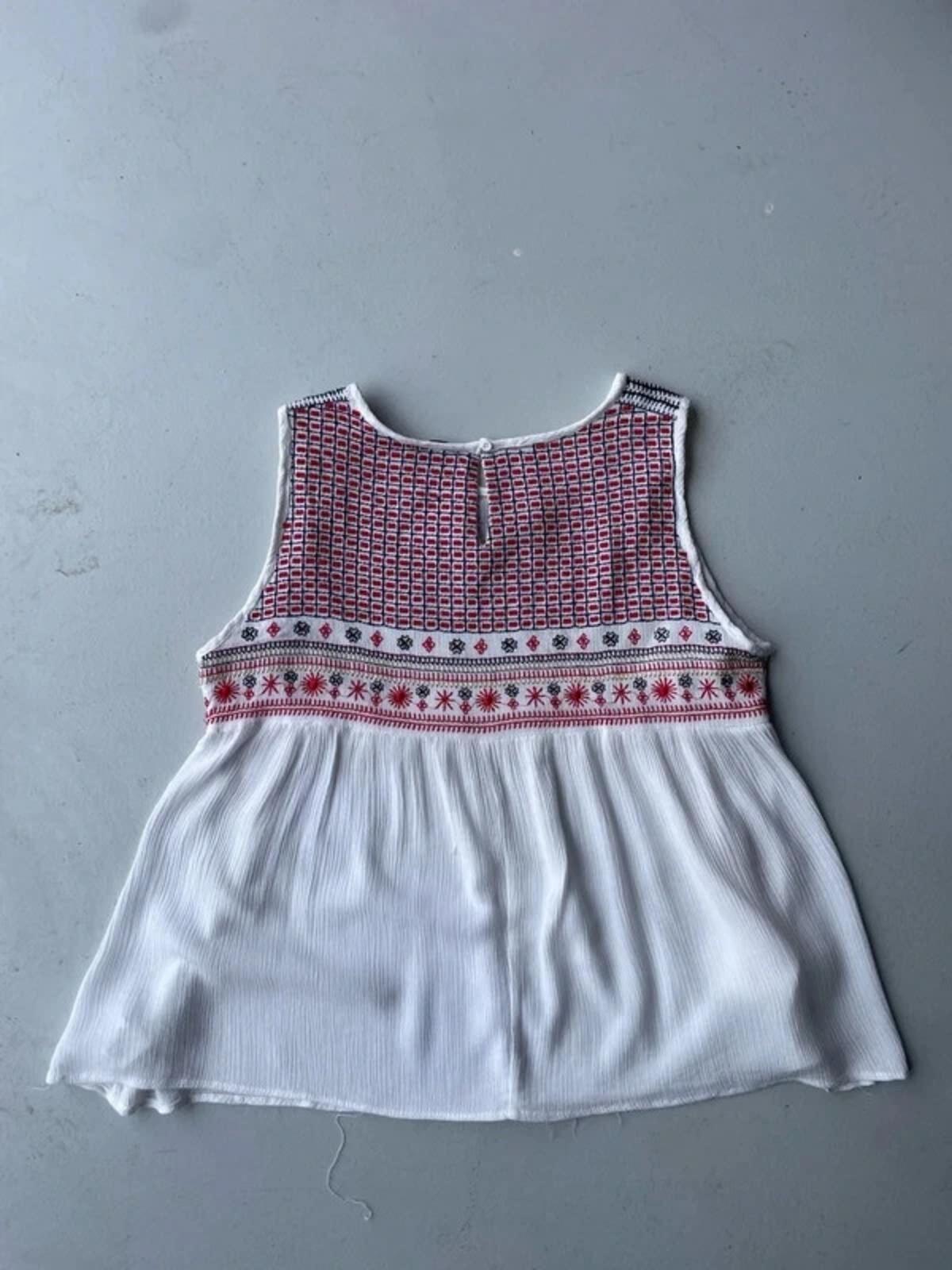 White cami with red embroidery and beading