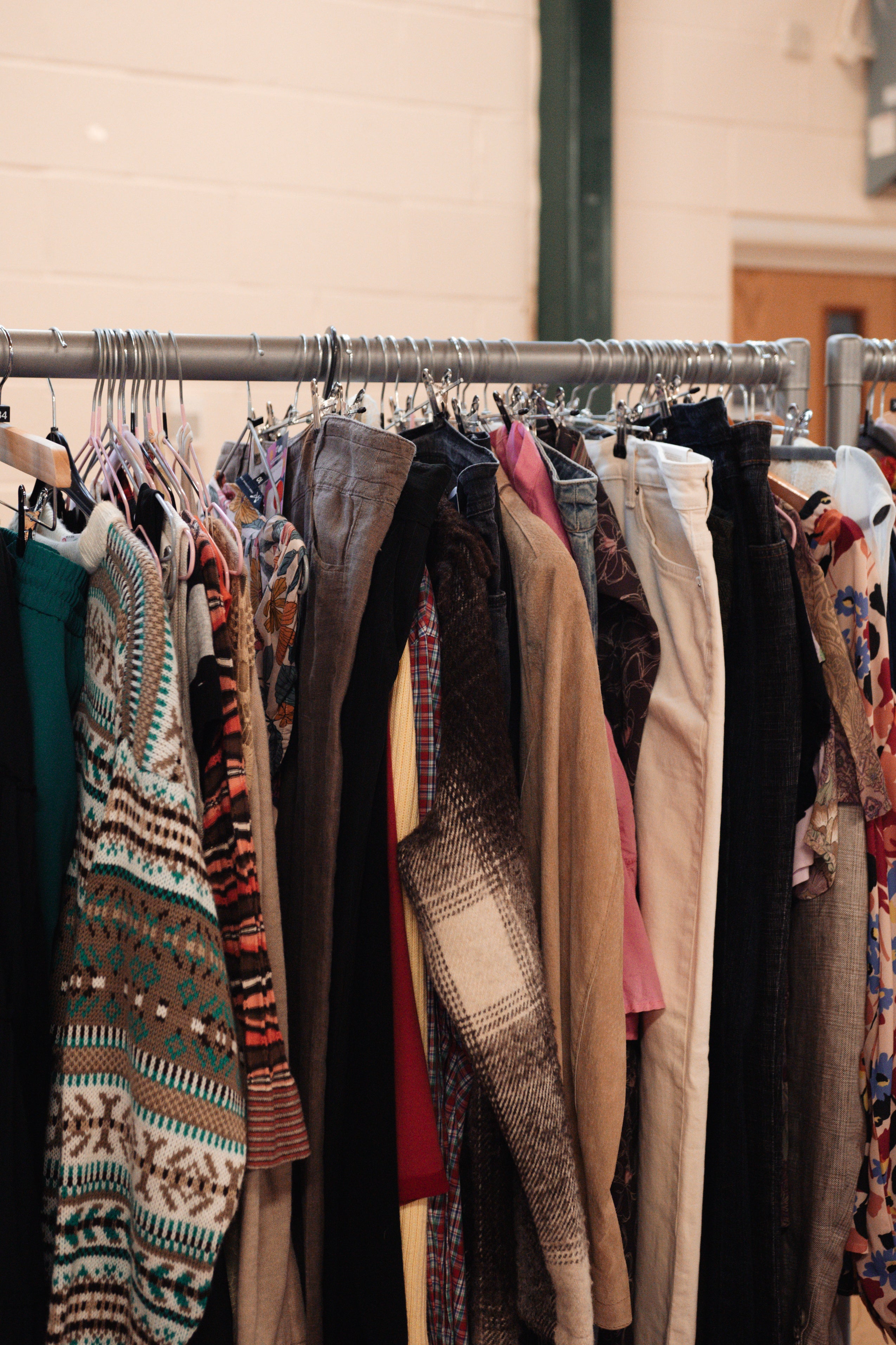 Clothing rack with various garments hanging on it