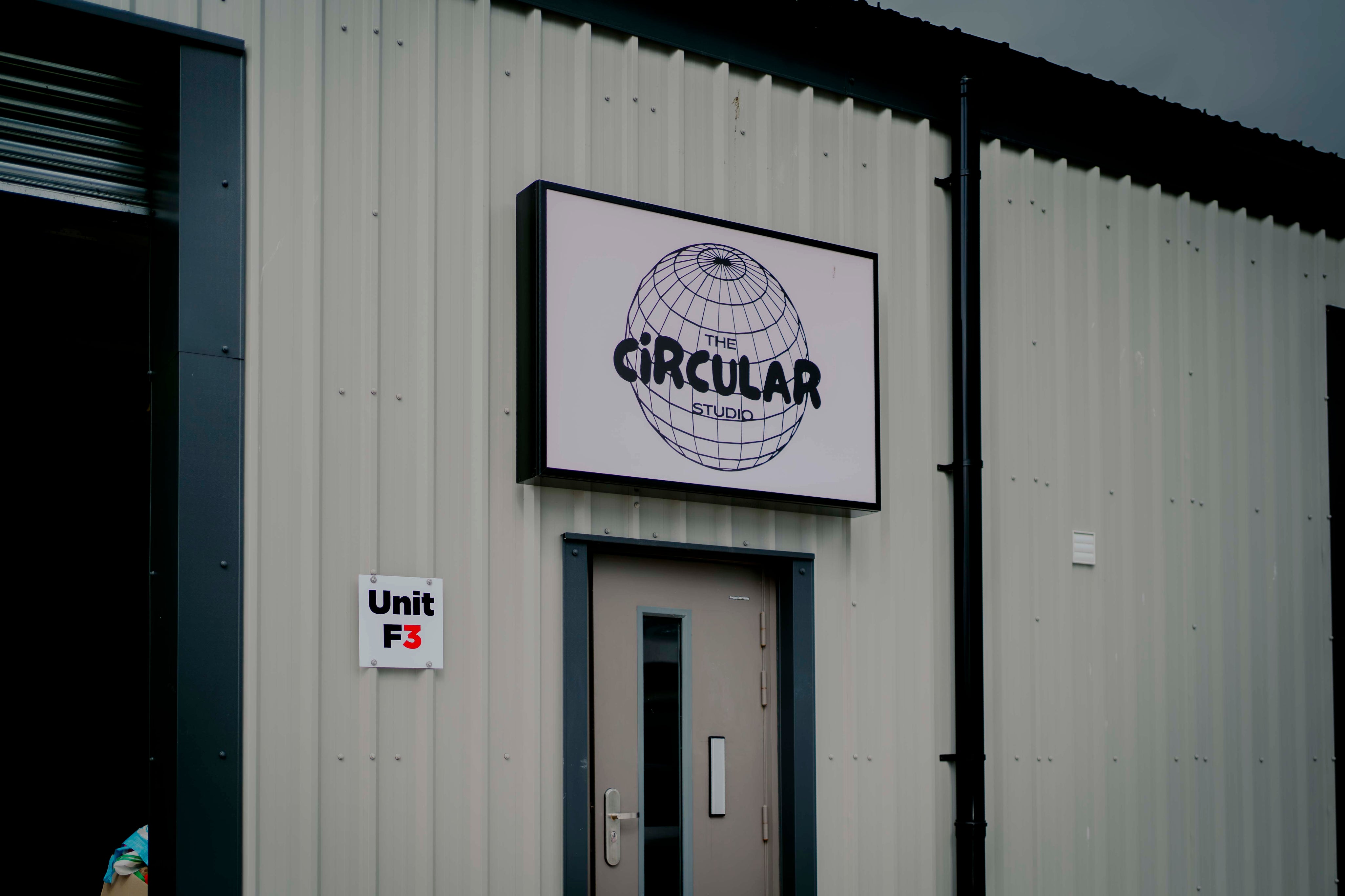 Building exterior with 'Circular' logo and 'Unit F3' sign.