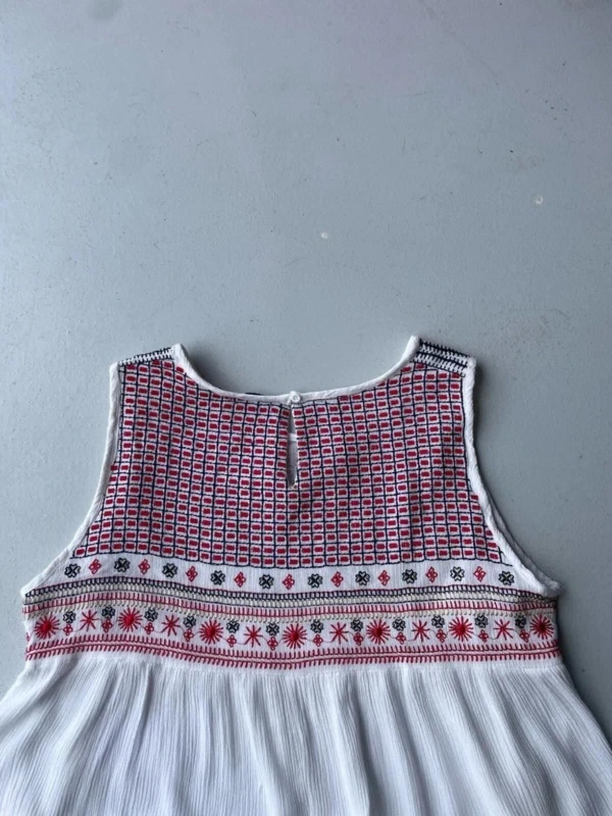 White cami with red embroidery and beading