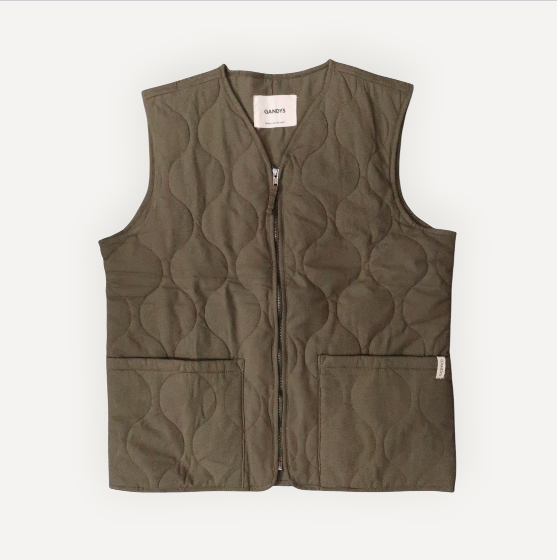 Quilted vest with geometric pattern on a white background