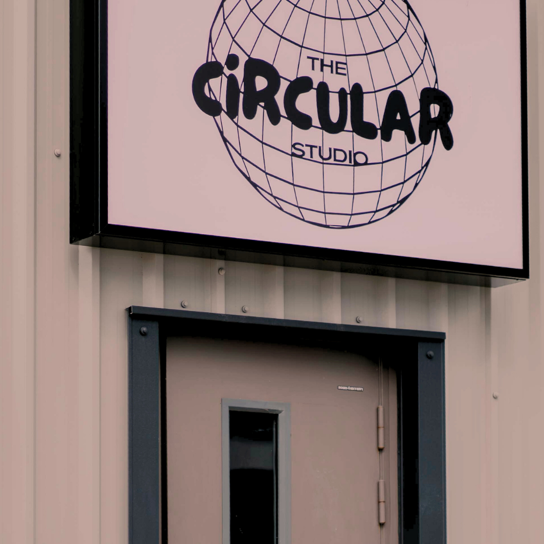Sign for 'The Circular Studio' on a building facade
